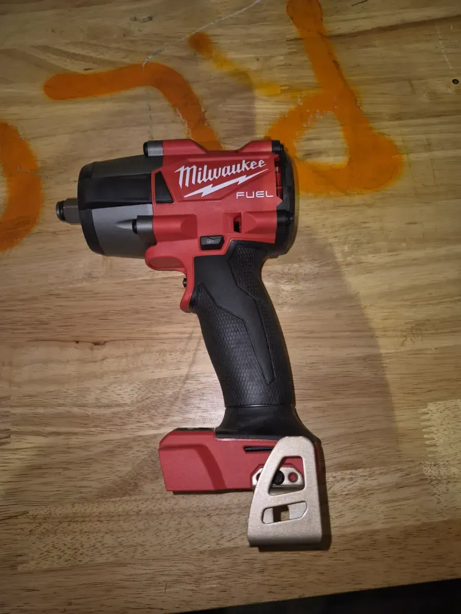 *Missing Button**Milwaukee M18 FUEL 1/2 in. Mid-Torque Impact Wrench (Tool Only) - image 1