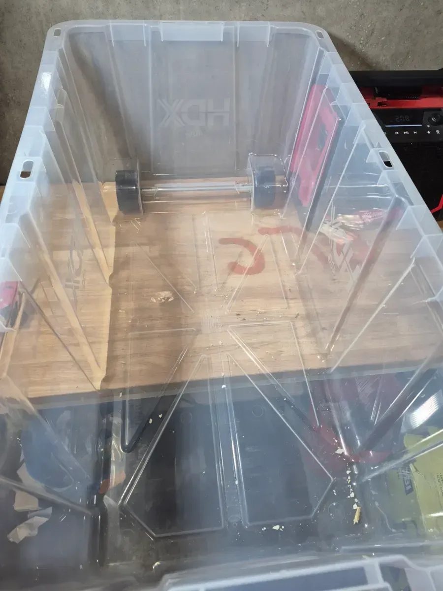 40 Gal. Tough Storage Tote with Wheels and Handle in Clear and Red - image 3