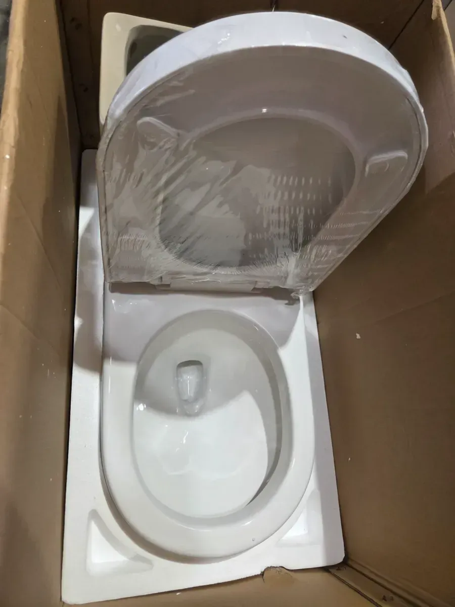 One-Piece 1.1/1.6 GPF Dual Flush Round Toilet in White Soft Close Seat Included - image 4