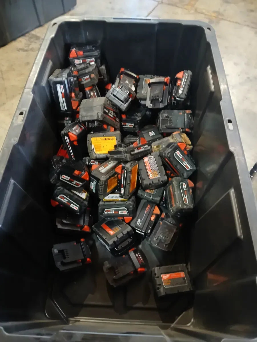 Lot of 64 non-functional Milwaukee batteries, assorted models - image 1