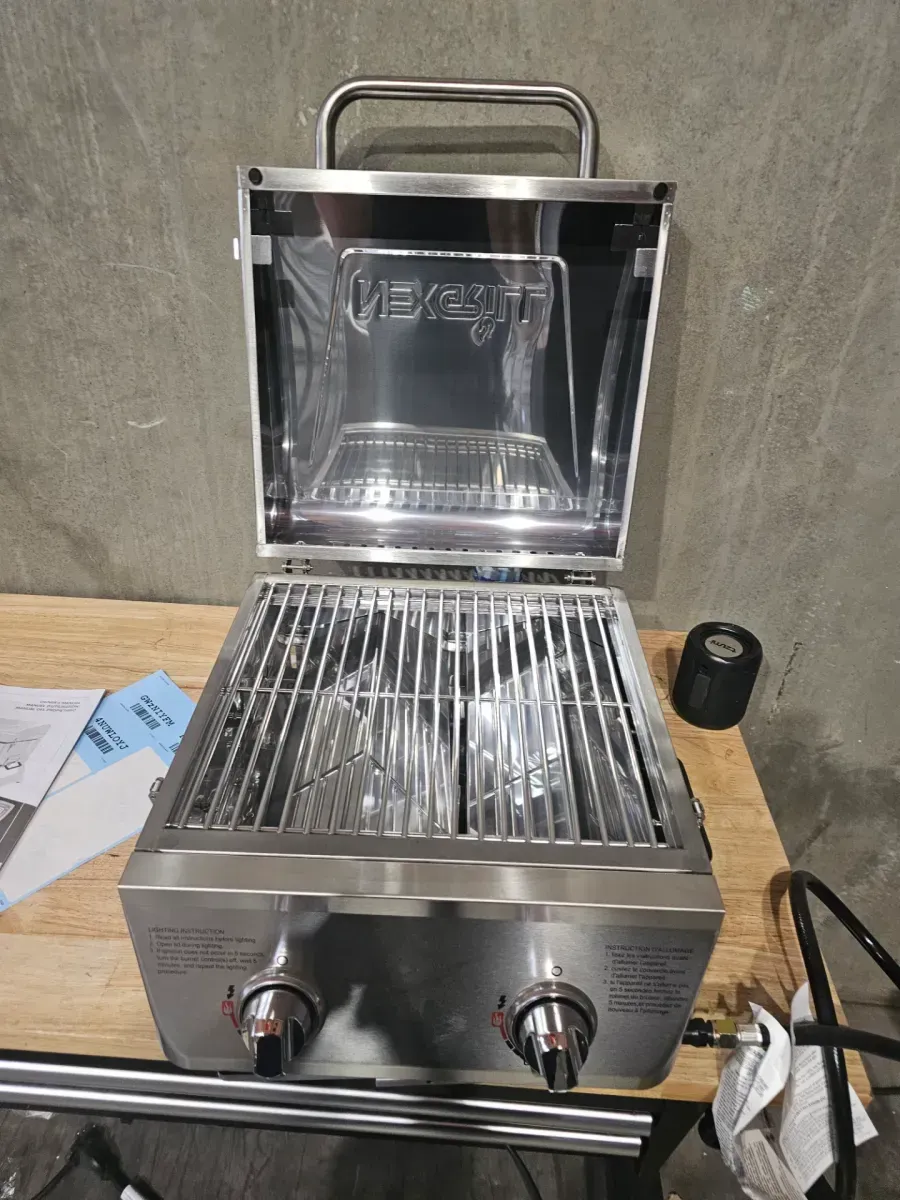 20,000 BTU Portable Propane Grill in Stainless Steel with Top Thermometer and Extra Flame Rod - image 1
