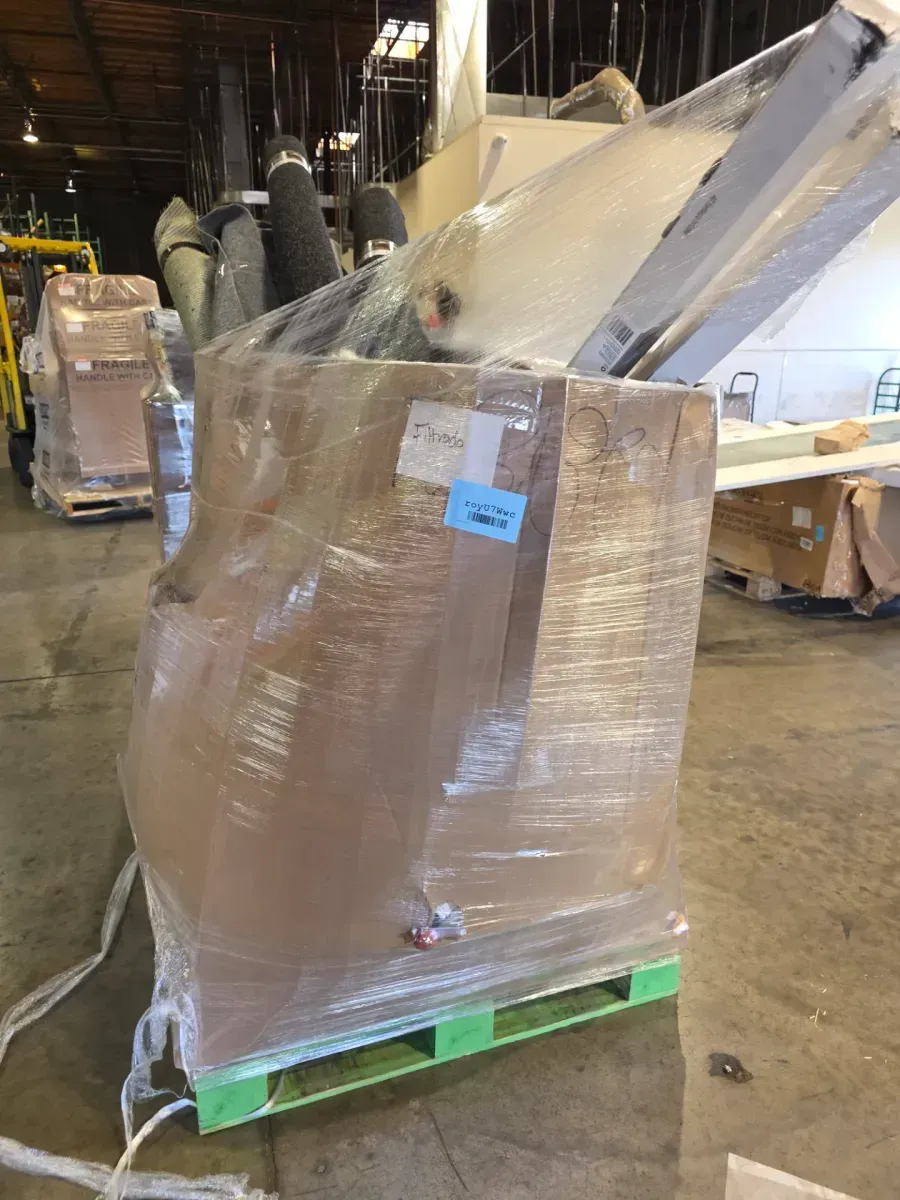 Pallet of Home Goods with Rolled Rugs and Door - image 1