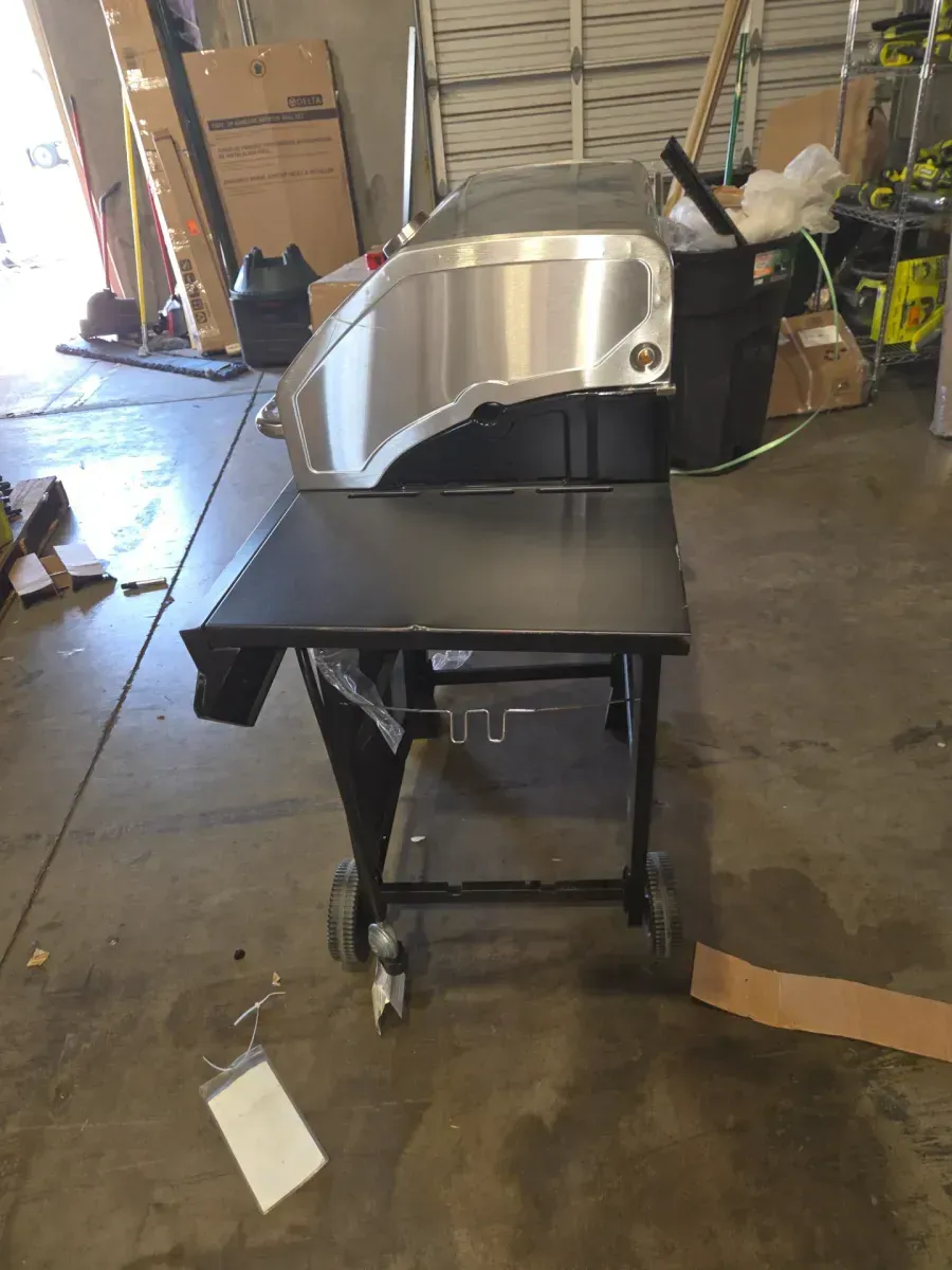 4-Burner Propane Gas Grill in Black with Stainless Steel Main Lid - image 9