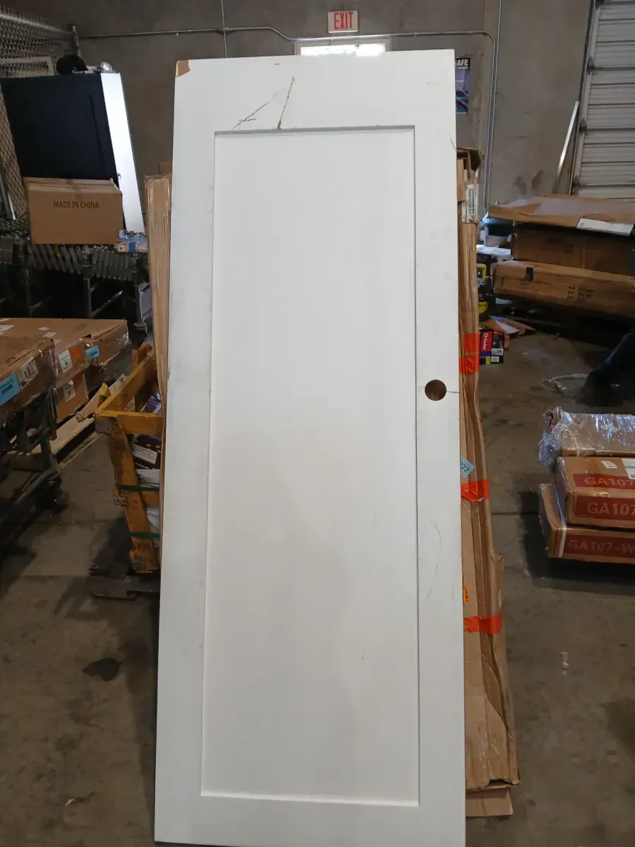 ***  has crack on the handle part and is damaged from the top part ***?30 in. x 80 in. x 1-3/8 in. Shaker White Primed 1-Panel Solid Core Wood Interior Slab Door - image 4