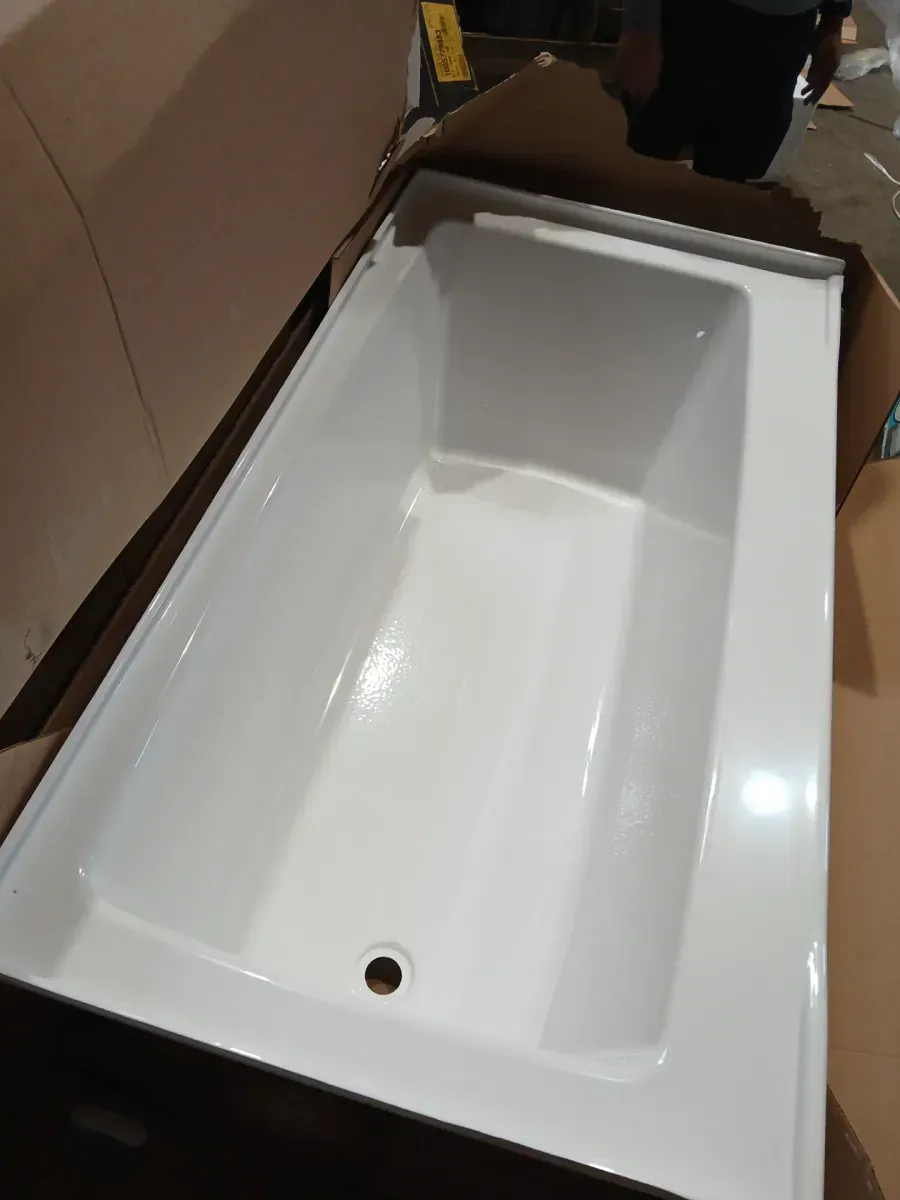 A pallet of bathtubs in various sizes and shapes; one of the four is cracked at the corner. - image 2