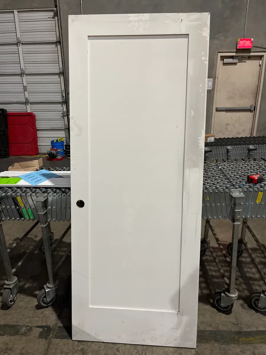 **has minor dents**32in. x 80 in. x 1-3/8 in. Shaker White Primed 2-Panel Solid Core Wood Interior Slab Door - image 2