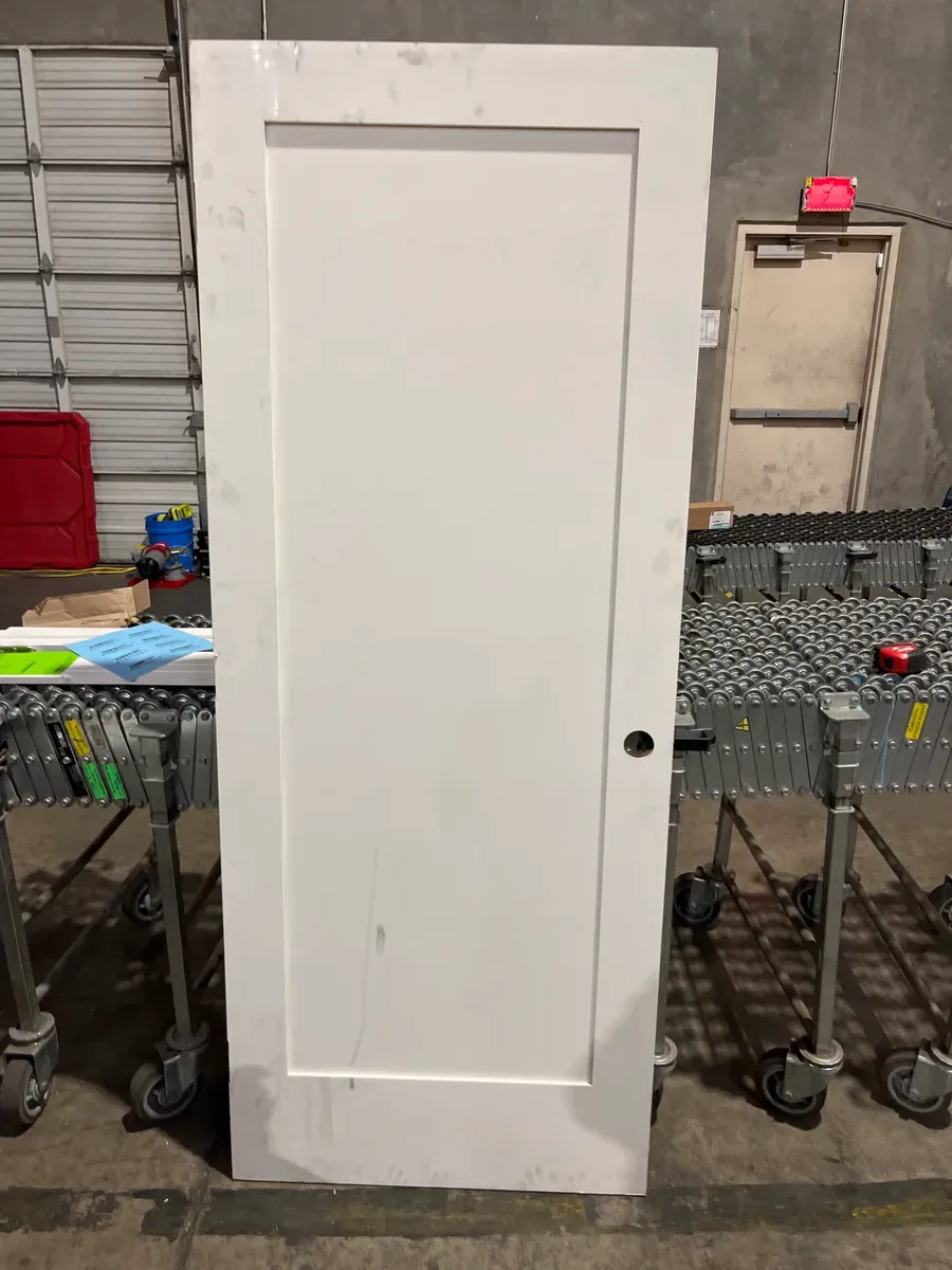 **has minor dents**32in. x 80 in. x 1-3/8 in. Shaker White Primed 2-Panel Solid Core Wood Interior Slab Door - image 3
