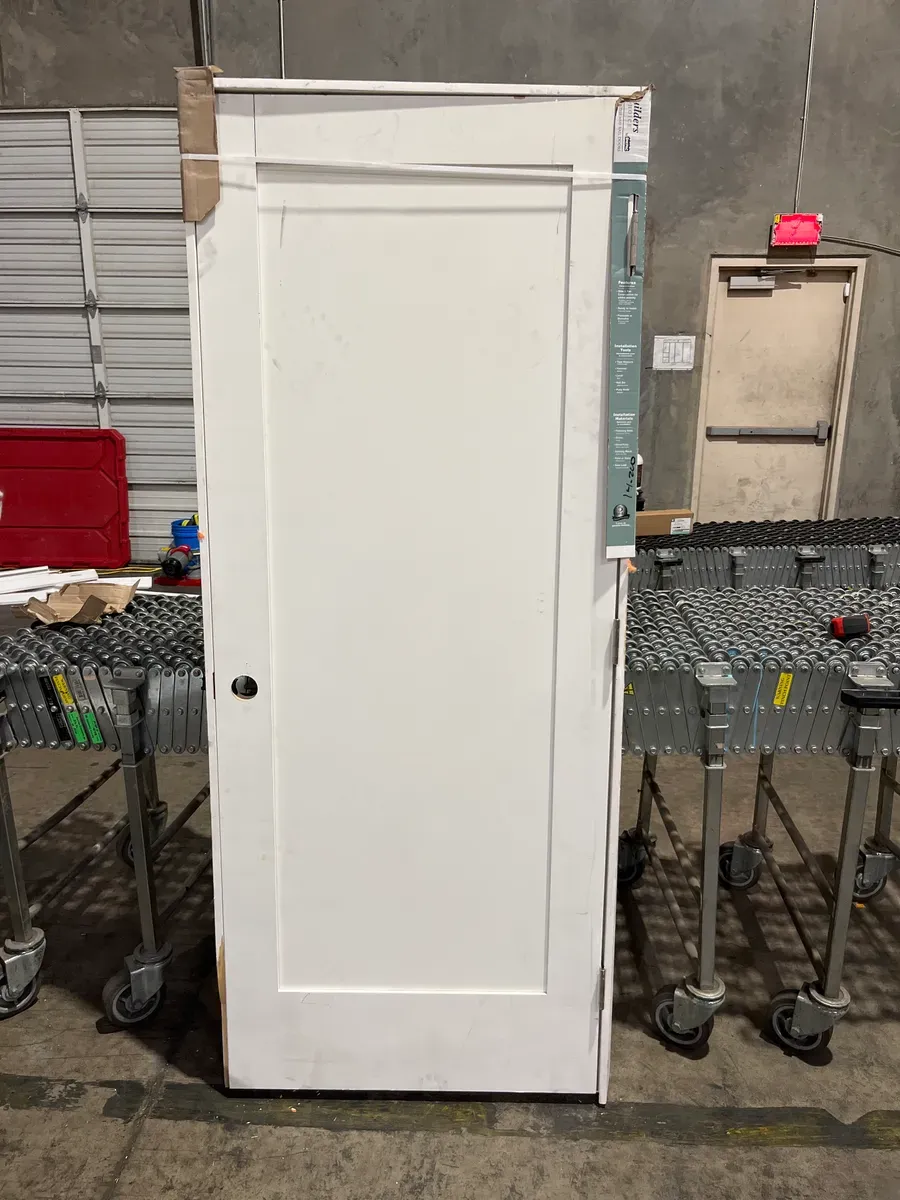 **frame is a little bit of damage in the door has minor dents **32 in. x 80 in. Shaker 1-Panel Primed Solid Hybrid Core MDF Left-Hand Single Prehung Interior Door - image 2