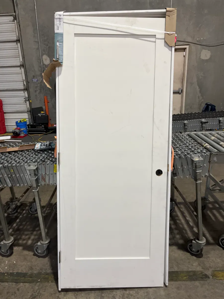 **frame is a little bit of damage in the door has minor dents **32 in. x 80 in. Shaker 1-Panel Primed Solid Hybrid Core MDF Left-Hand Single Prehung Interior Door - image 2