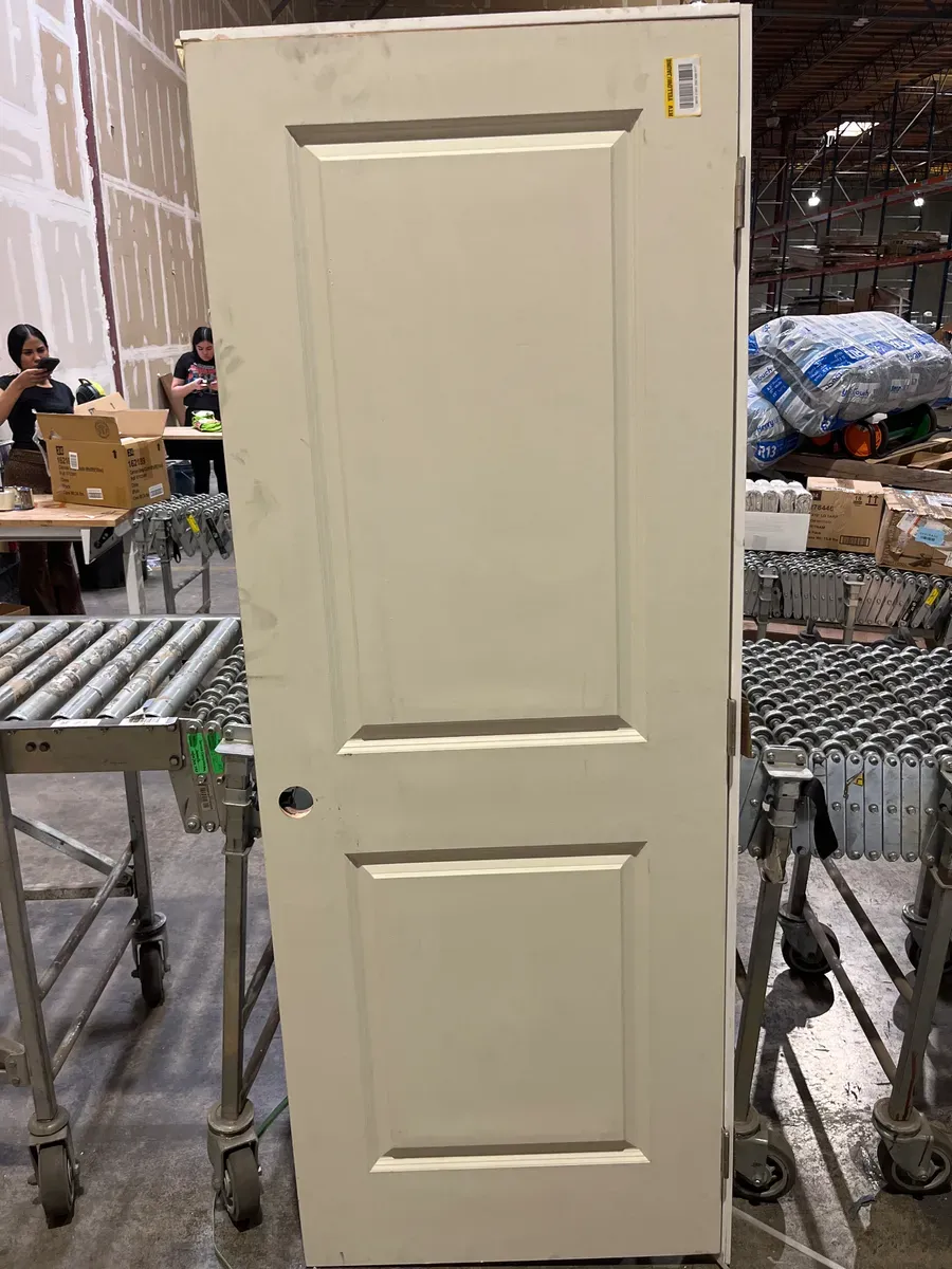 **frame is broken and the door is a bit dirty ***30 in. x 80 in. 2-Panel Square Top Left Hand Solid Core White Primed Molded Single Prehung Interior Door w/Nickel Hing - image 3