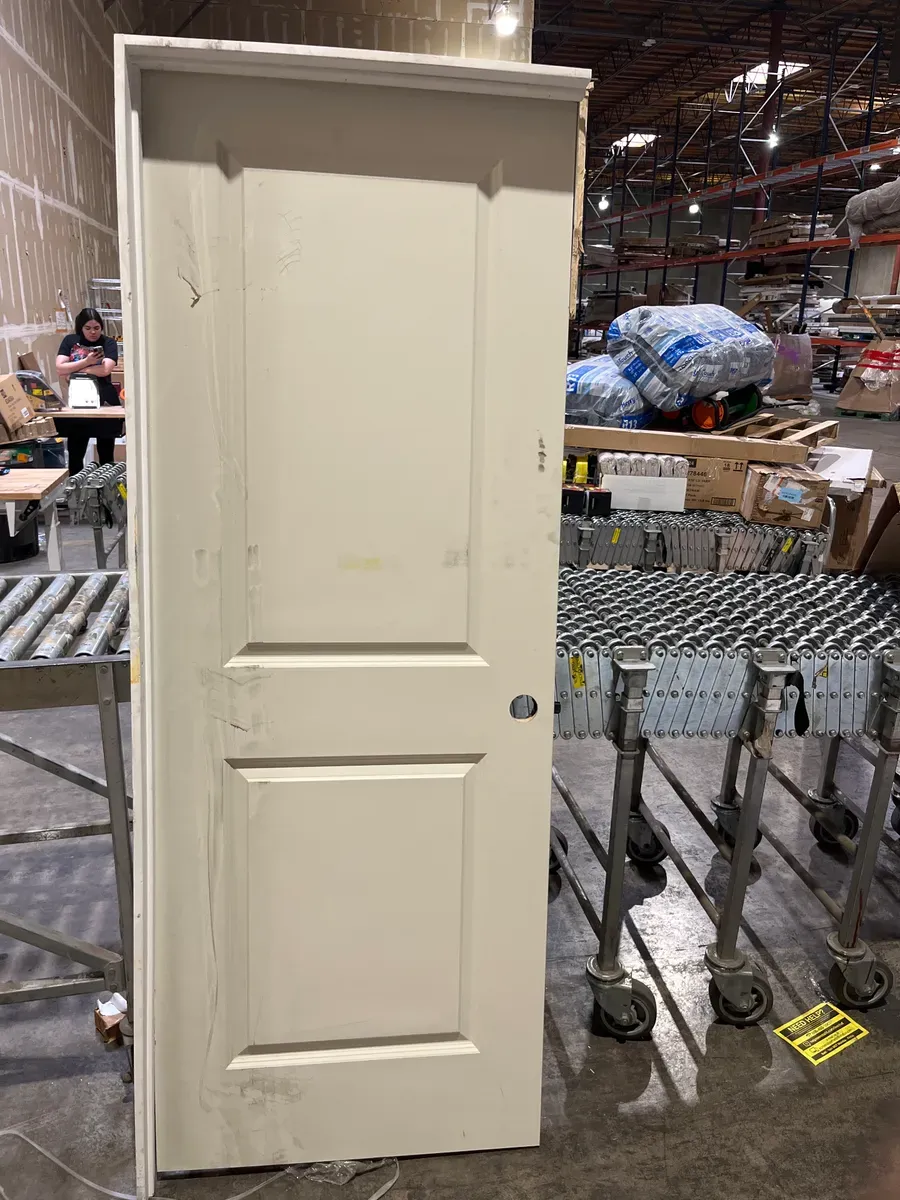 **frame is broken and the door is a bit dirty ***30 in. x 80 in. 2-Panel Square Top Left Hand Solid Core White Primed Molded Single Prehung Interior Door w/Nickel Hing - image 3