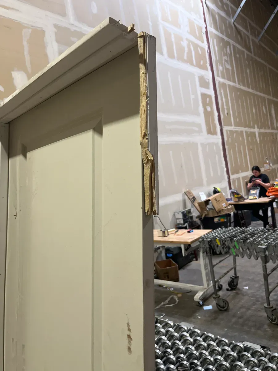 **frame is broken and the door is a bit dirty ***30 in. x 80 in. 2-Panel Square Top Left Hand Solid Core White Primed Molded Single Prehung Interior Door w/Nickel Hing - image 4