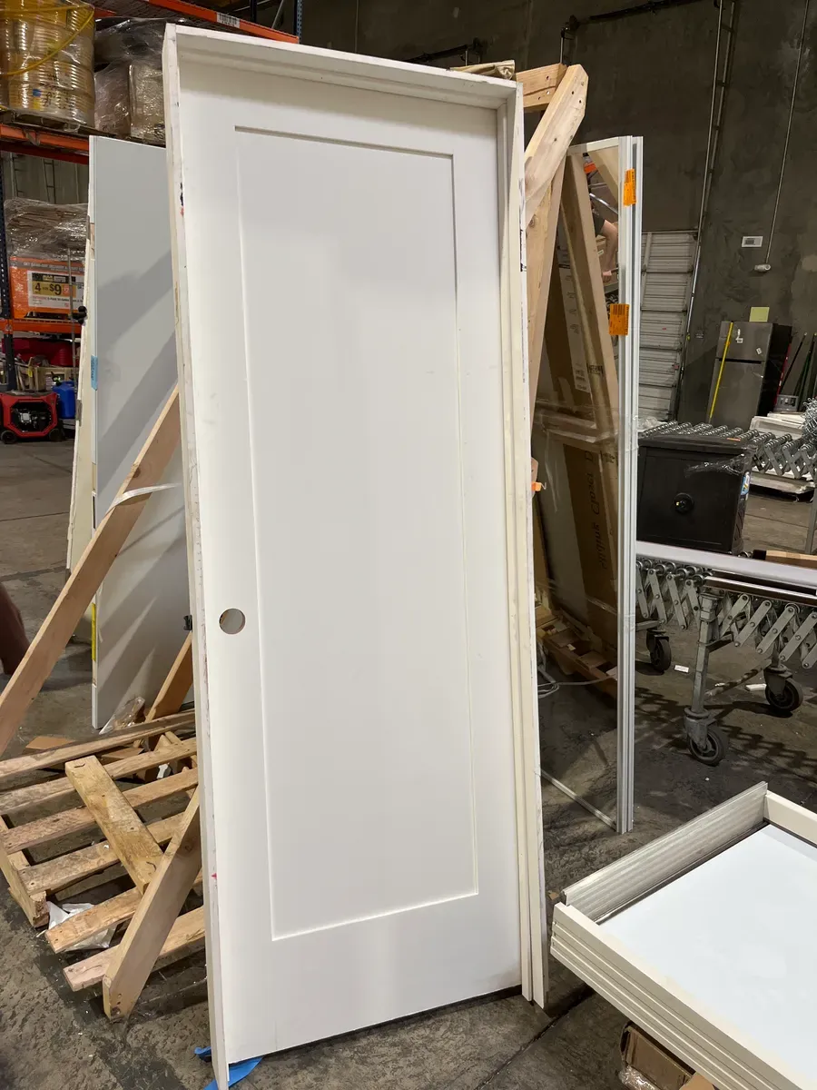 *** It has some stains but everything is fine ***28 in. x 80 in. 1 Panel Left-Handed Primed Composite Solid Core Single Prehung Interior Door 4-9/16 in. Flat Jamb - image 1