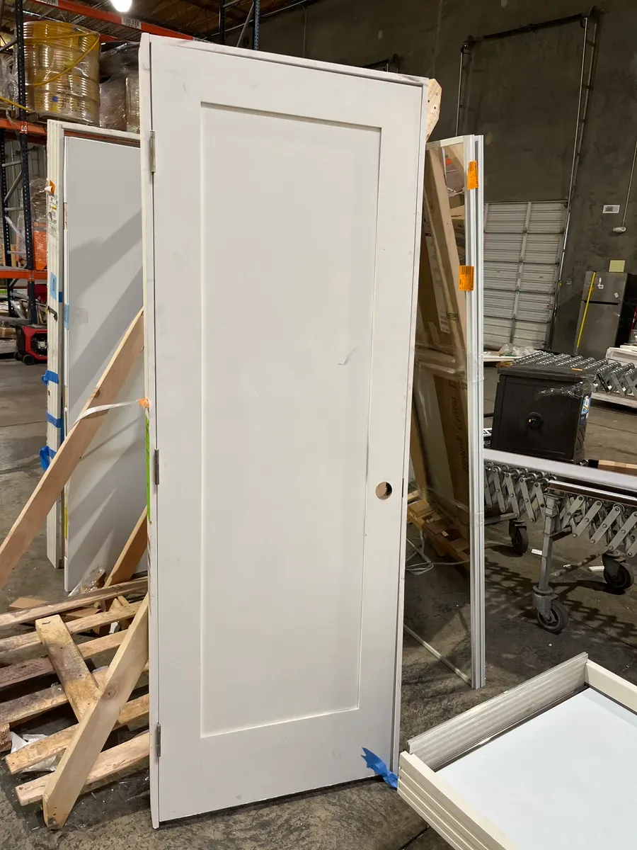 *** It has some stains but everything is fine ***28 in. x 80 in. 1 Panel Left-Handed Primed Composite Solid Core Single Prehung Interior Door 4-9/16 in. Flat Jamb - image 2