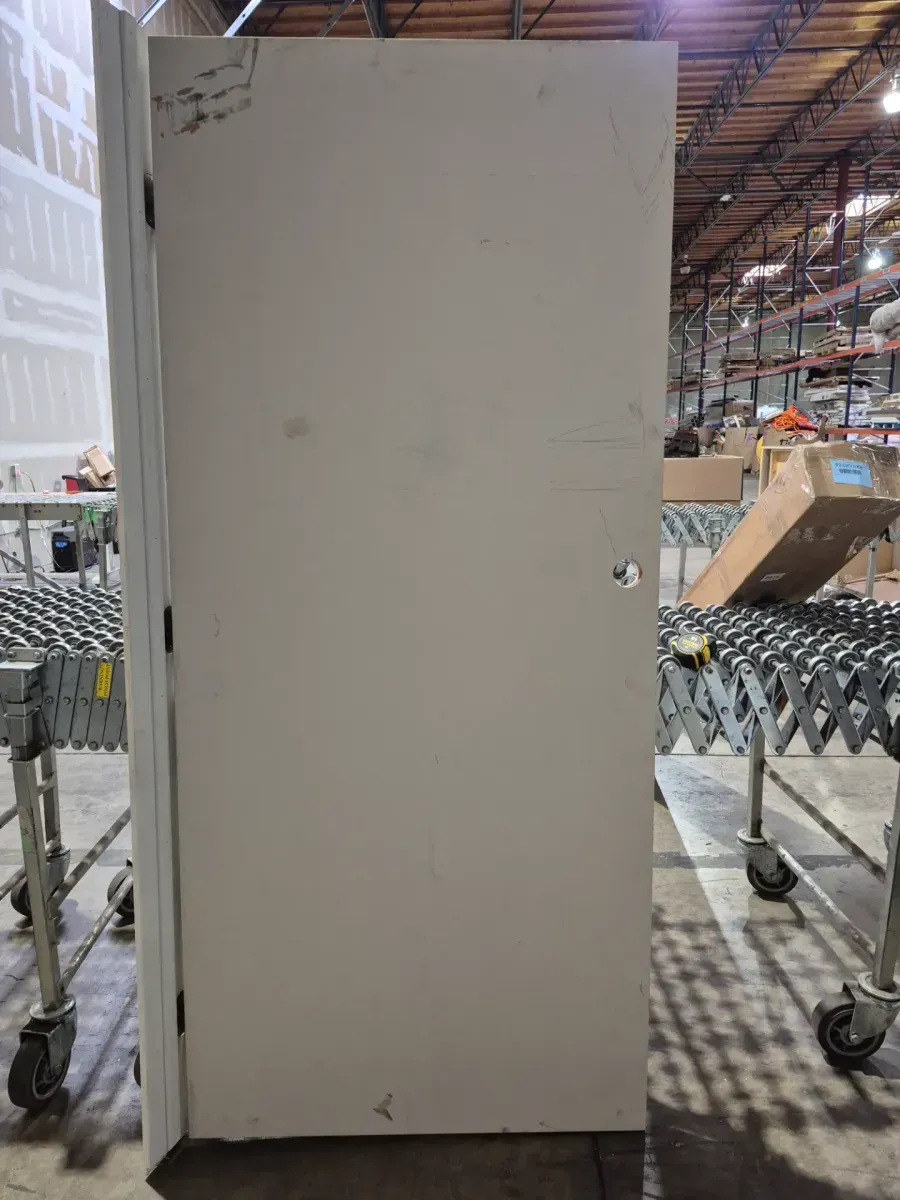 **frame is broken in yye door handle part has a little crack **36 in. x 80 in. No Panel Right-Handed Primed Composite Hollow Core Single Prehung Interior Door 4-9/16 in. Flat Jamb - image 2