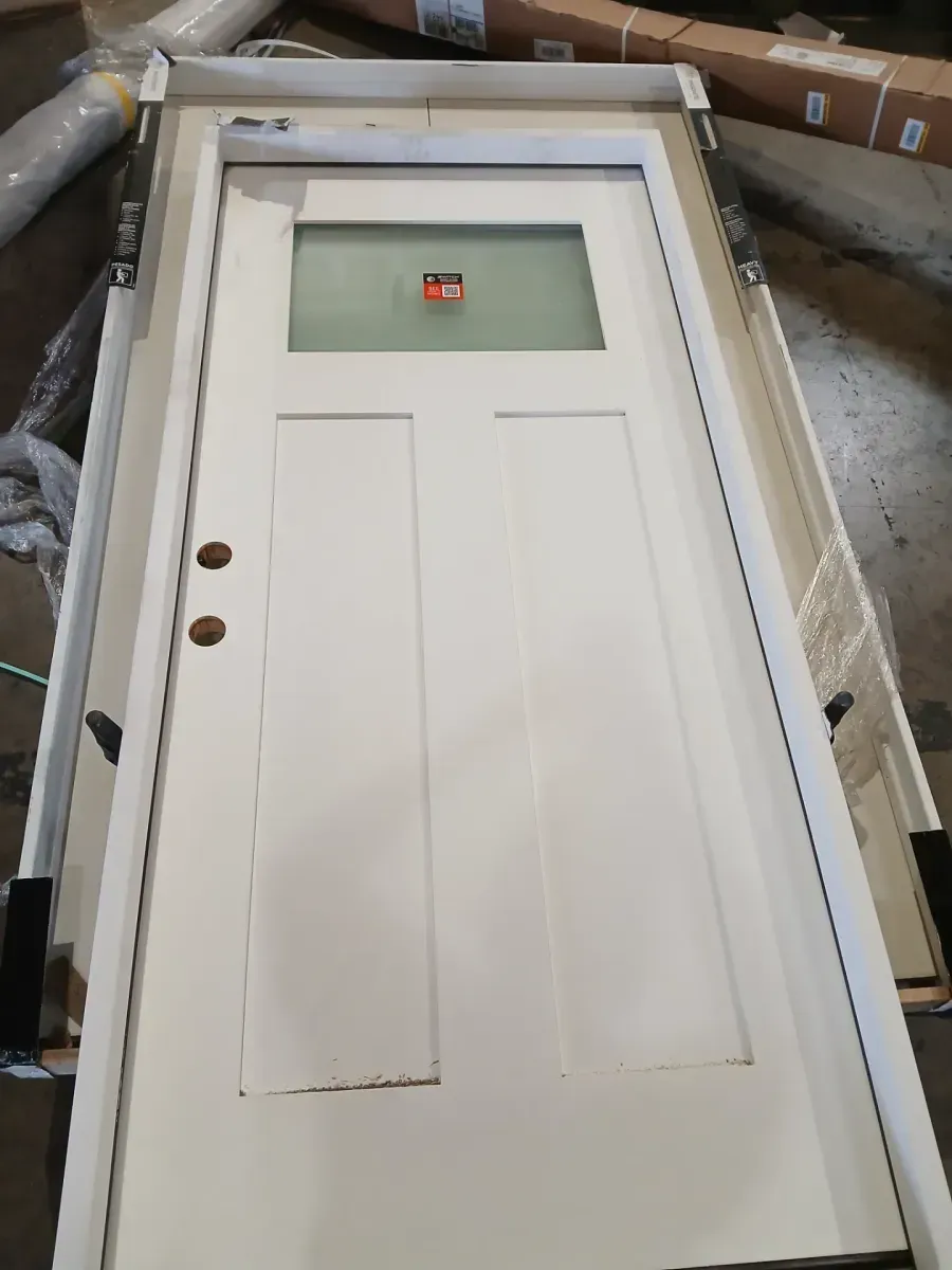 **the bottom is a bit dented **35 in. x 79n. Right-Hand 1/4 Lite Craftsman Micro-Granite Glass Primed Fiberglass Prehung Front Door - image 4