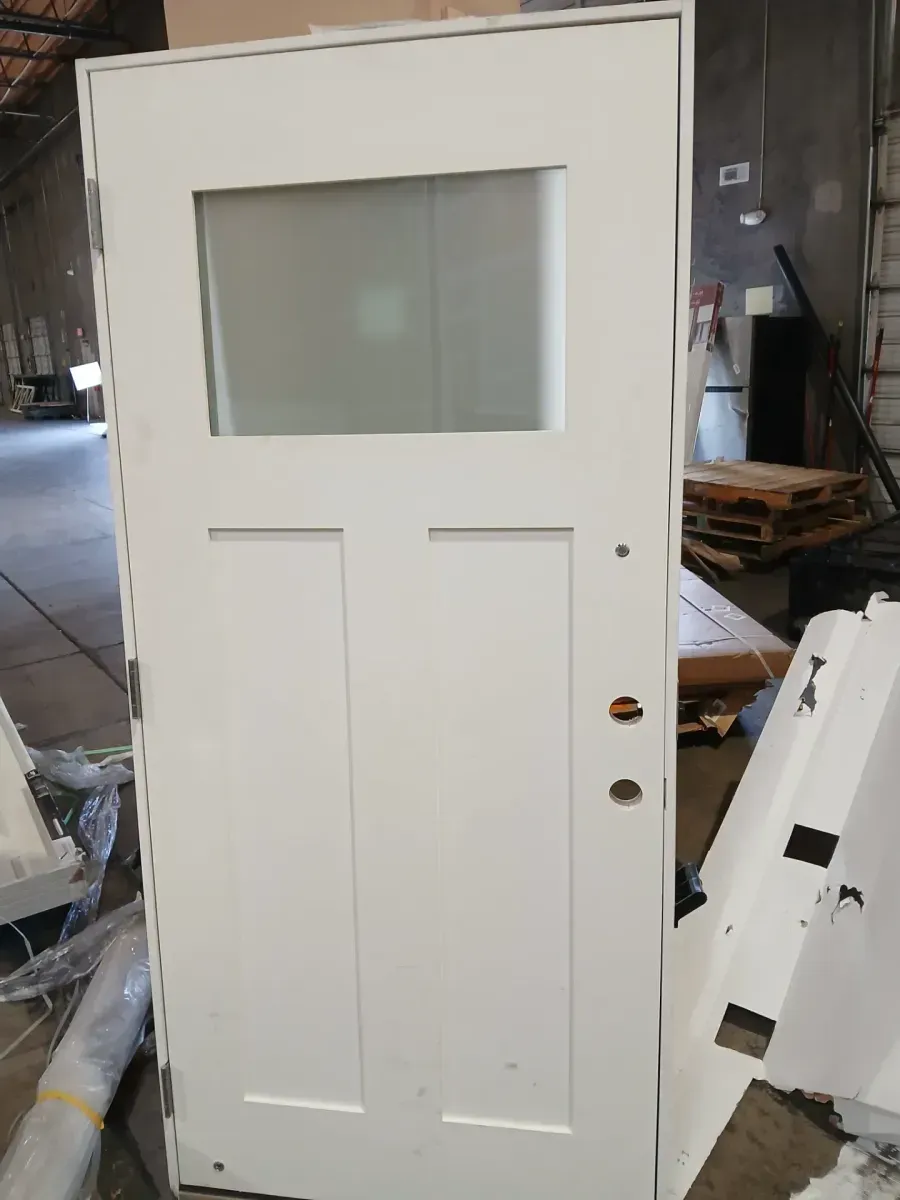 **the bottom is a bit dented **35 in. x 79n. Right-Hand 1/4 Lite Craftsman Micro-Granite Glass Primed Fiberglass Prehung Front Door - image 3