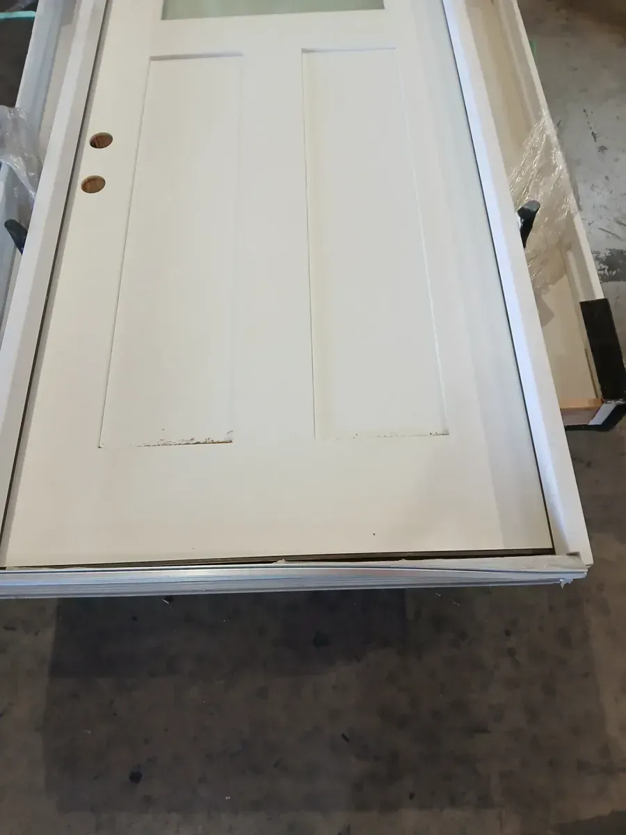 **the bottom is a bit dented **35 in. x 79n. Right-Hand 1/4 Lite Craftsman Micro-Granite Glass Primed Fiberglass Prehung Front Door - image 5