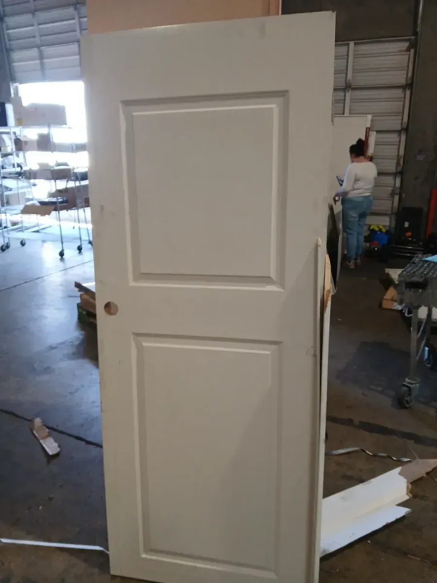 **has minor dents and the frame is broken **32 in. x 80 in. Primed 2-Panel Square Hollow Core Composite Interior Door Slab - image 5