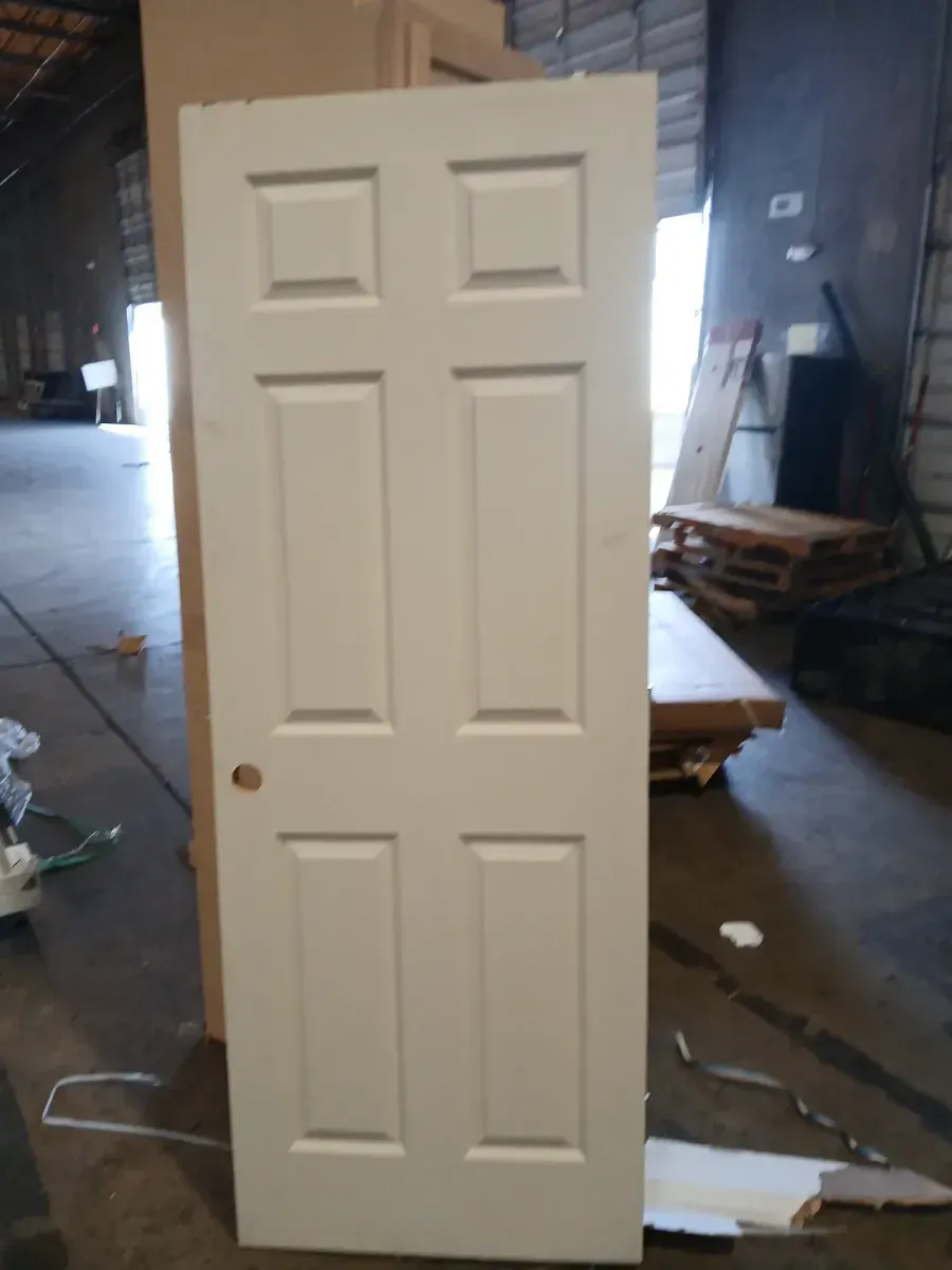**broken frame and minor dent**29.10 in. x 80 in. 6 Panel Right-Handed Primed Composite Hollow Core Single Prehung Interior Door 4-9/16 in. Flat Jamb - image 2