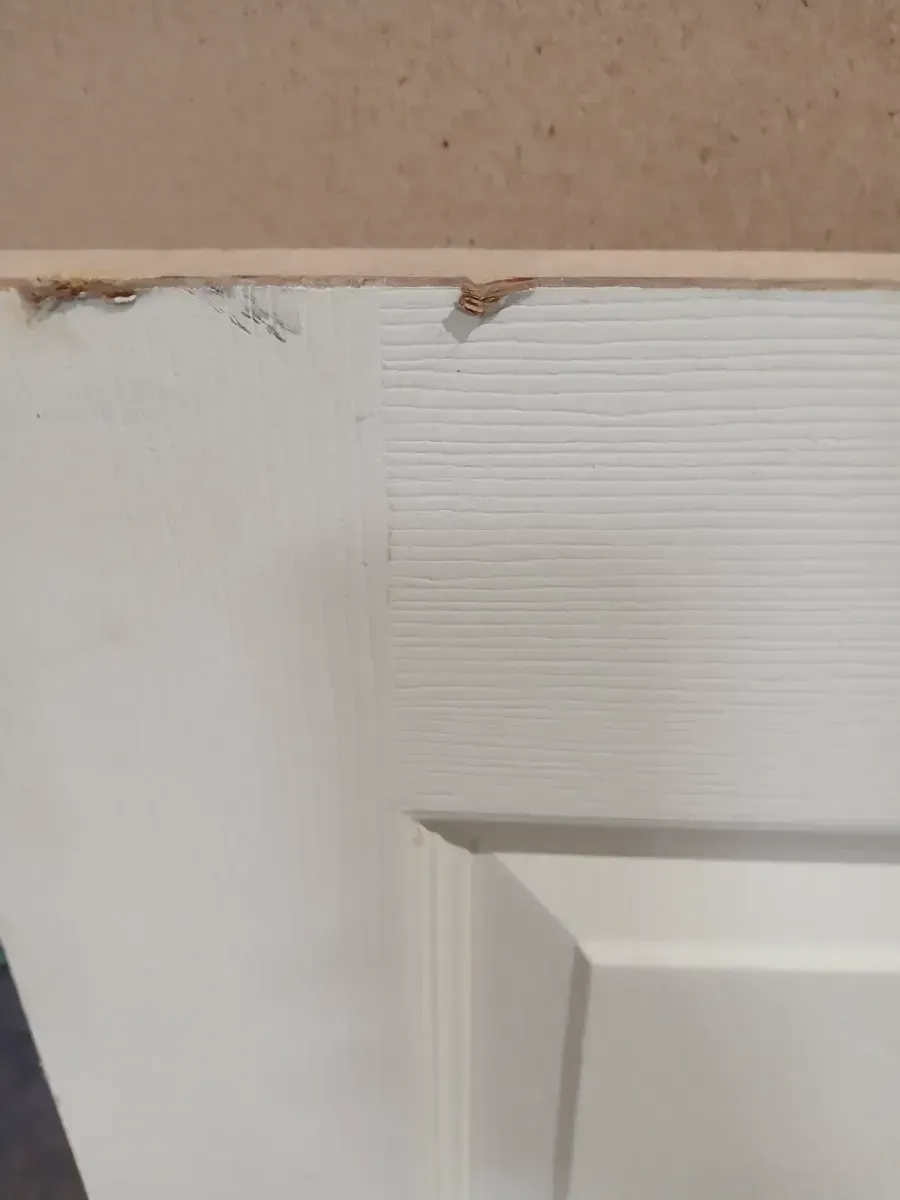 **broken frame and minor dent**29.10 in. x 80 in. 6 Panel Right-Handed Primed Composite Hollow Core Single Prehung Interior Door 4-9/16 in. Flat Jamb - image 3