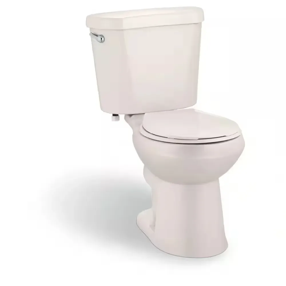 12 in. Rough In Two-Piece 1.28 GPF Single Flush Round Toilet in Biscuit, Seat Included - image 1